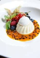 dessert with wild berry sauce