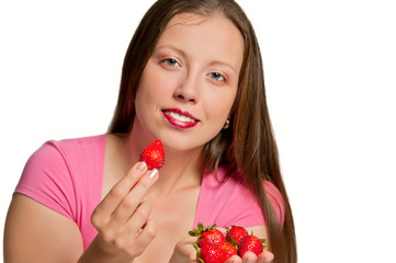 Girl gives strawberry