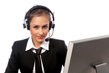 girl with a headset works at the computer