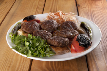 meatballs menu in White Plate on Wooden Table