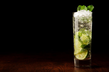Mojito Cocktail on a wooden table - obrazy, fototapety, plakaty