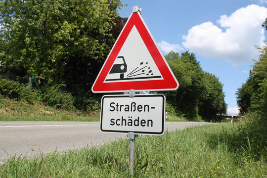 Schild Strassenschäden IX