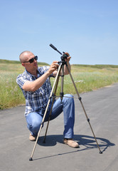 young man with tripod