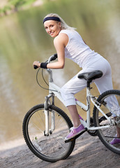 Naklejka premium woman riding a bicycle