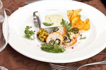 fish roll with sauce and potato chips