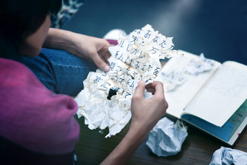 Teen staring at a japanese script