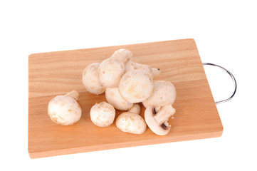 mushrooms on the cutting board isolated on the white background