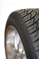 Low-profile car wheel on a white background close up