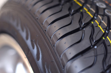 Low-profile car wheel on a white background close up
