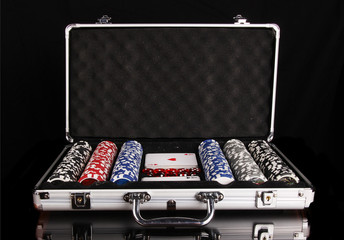 Poker equipment in case, isolated on black background