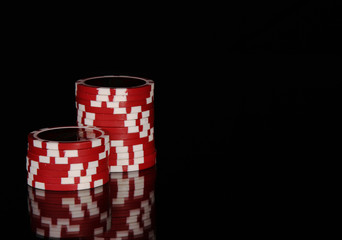 Casino chips on black background