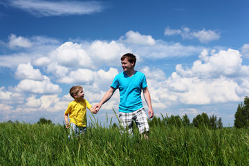 Fototapeta premium father with son in summer day outdoors