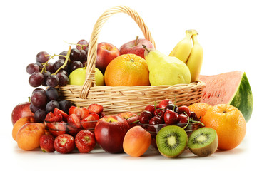 Fruits and wicker basket isolated on white