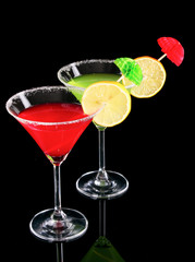 Martini glasses on black background