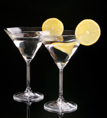 Martini glasses on black background