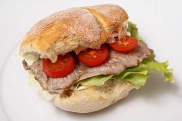 Beef steak sandwich with tomato and lettuce