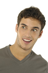 Fototapeta premium Closeup of a handsome young teenaged guy looking away in thought