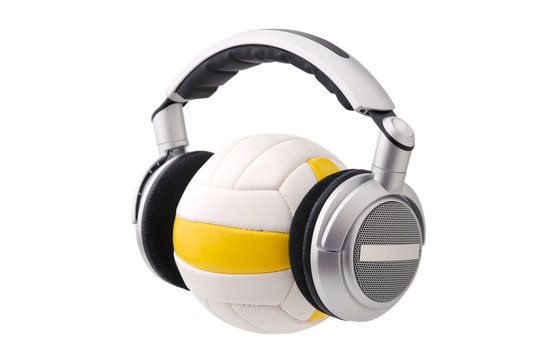 Headphones on a volleyball ball, sport and music concept