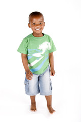 Three year old black or african american boy standing smiling