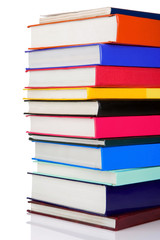 pile of new books isolated on white