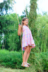 Young girl on swing