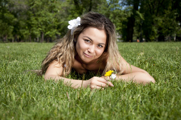 beautiful young woman on field in summer