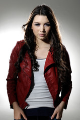 Portrait of a young beautiful woman posing in light background