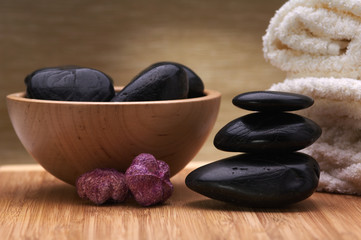 spa towel. black balanced hot stones