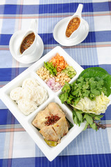 Cooked rice with fish in sauces and fried cuttlefish