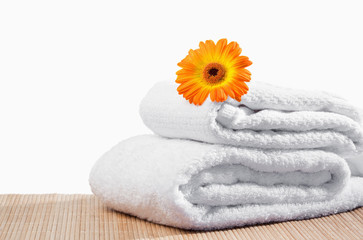 Fototapeta na wymiar White towels under a sunflower