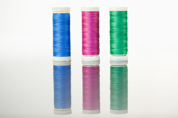 Colorful spools of thread on a table