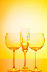 Wine glasses against gradient background