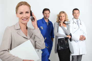 Secretary on phone with mechanic