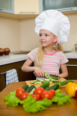 Little girl preparing healthy food on kitchen