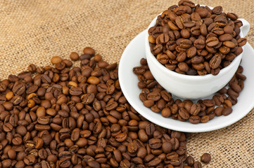 White cup with coffee grains