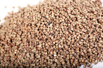 uncooked Buckwheat groats close-up as background