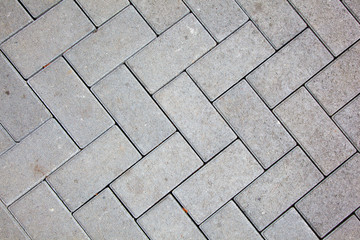 Naklejka premium pavement pattern made with cast concrete blocks in grey color