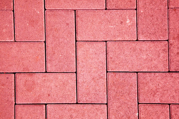 pavement pattern made with cast concrete blocks in red color