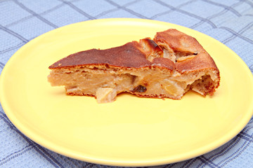 An apple pie on a yellow plate