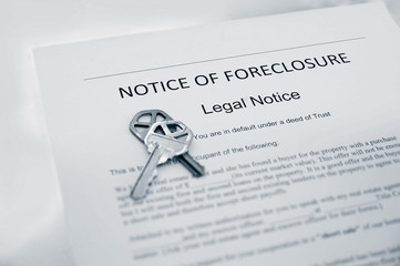 Notice of Foreclosure document and house key