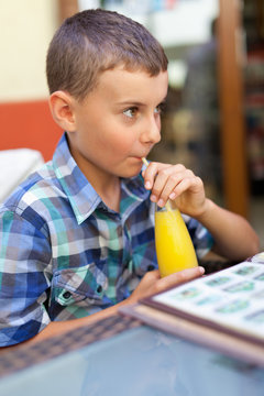 Child Drinking Orange Juice