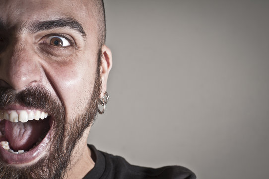 mid-frontal portrait of a man yelling