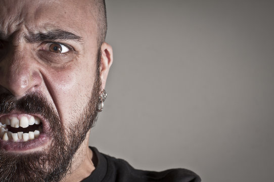 mid-frontal portrait of a man yelling