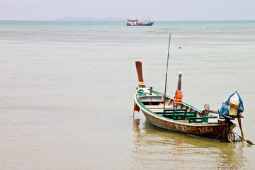 Naklejka na ściany i meble Fisherman boat at the beach, Phuket, Thailand