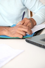 Fototapeta premium Closeup on human hands signing contract