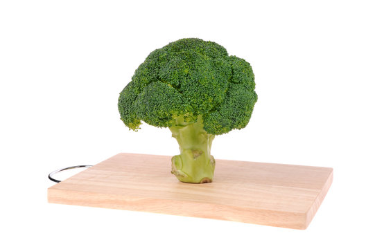 broccoli on cutting board isolated on white