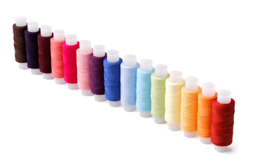 Perspective row of multicoloured threads