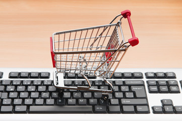 Internet online shopping concept with computer and cart