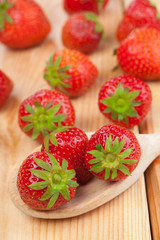 Strawberries on wooden spoon