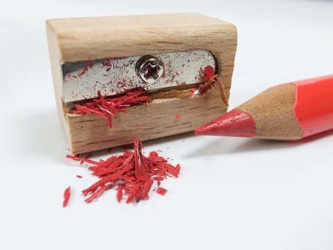 Red Pencil Crayon In A Pencil Sharpener